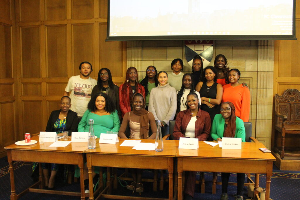 Black women at a panel discussion event