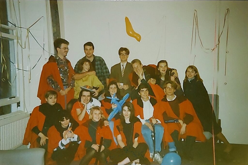 students in the 1990s wearing red gowns