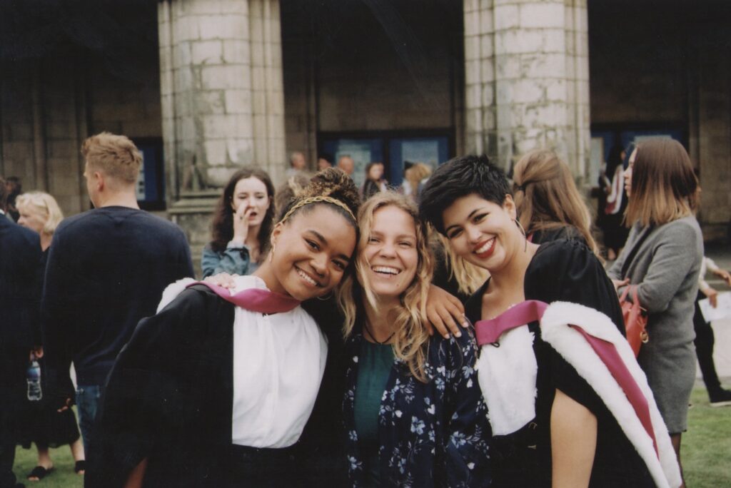 Berta pictured alongside two fellow St Andrews alumni in St Salvator's Quad.