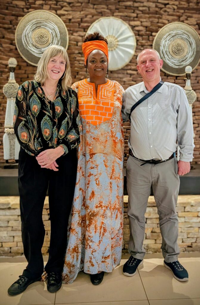 Professor Nicki Hitchcott (left) poses for a photos alongside her current research team, Dr Alice Karekezi and Dr John McInally