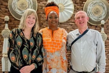 Professor Nicki Hitchcott (left) poses for a photos alongside her current research team, Dr Alice Karekezi and Dr John McInally