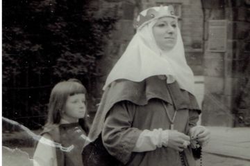A female student and young girl in costume, walking in the Kate Kennedy Procession, 1972