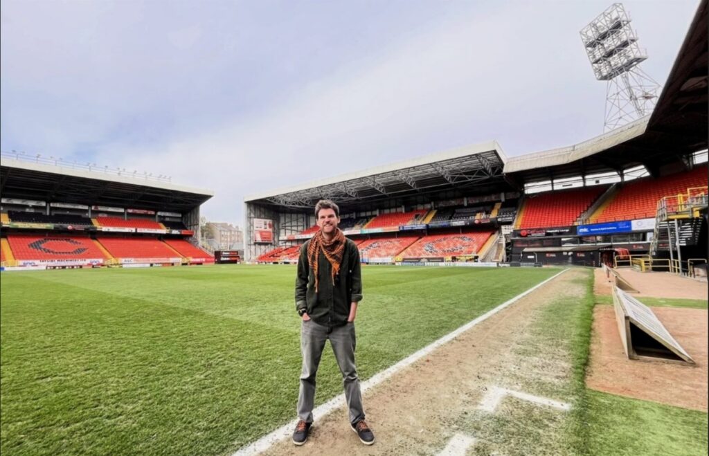 Fergus poses for a photo on the grounds of Tannadice Park, Dundee