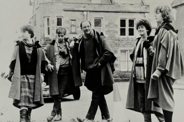 A group of students wearing University of St Andrews gowns, pictured in black and white, in the 1980s.