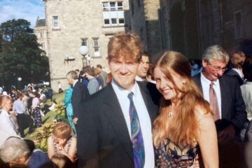 A student couple at graduation in the 1990s.