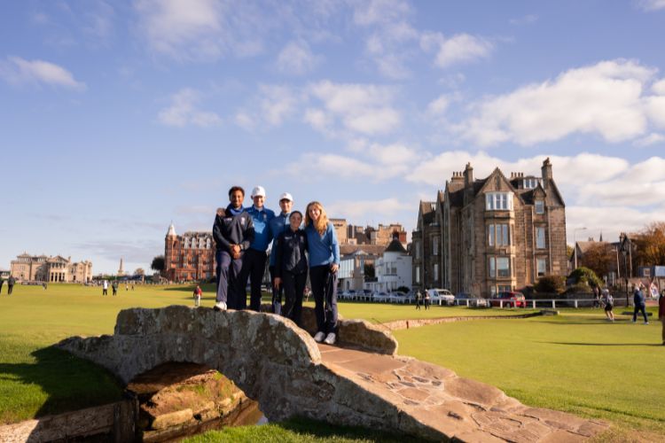 Saints Golf student athletes on the Swilcan Bridge